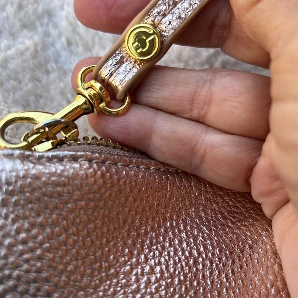 Francesca’s Rose Gold Clutch Wristlet